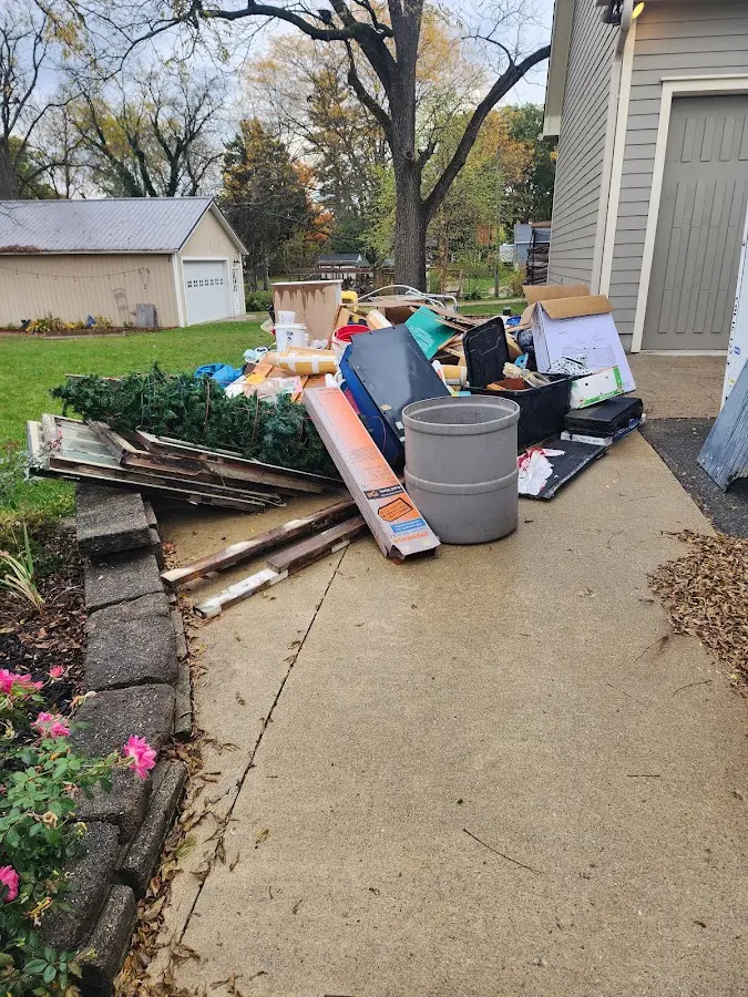 Dumpster being loaded with debris for Commercial Dumpster Rental in Lucas Valley-Marinwood